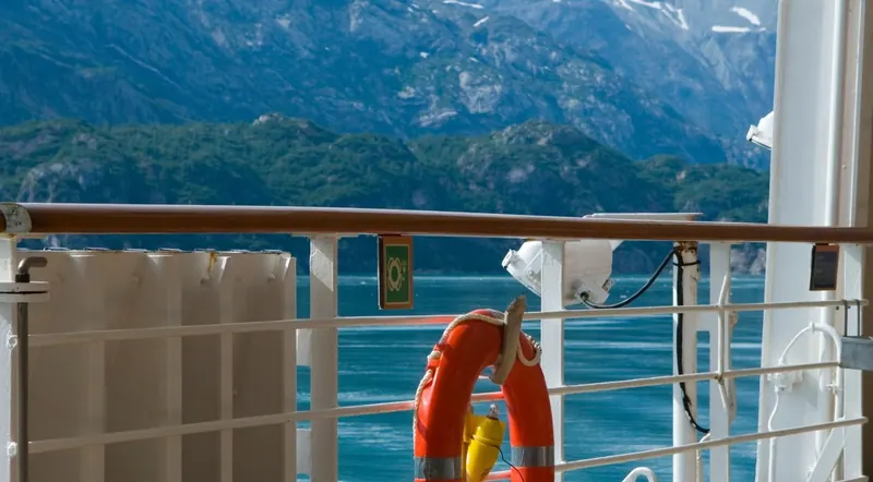 Cruise boat deck railing and life ring on a Kenai Fjords tour out of Seward, Alaska